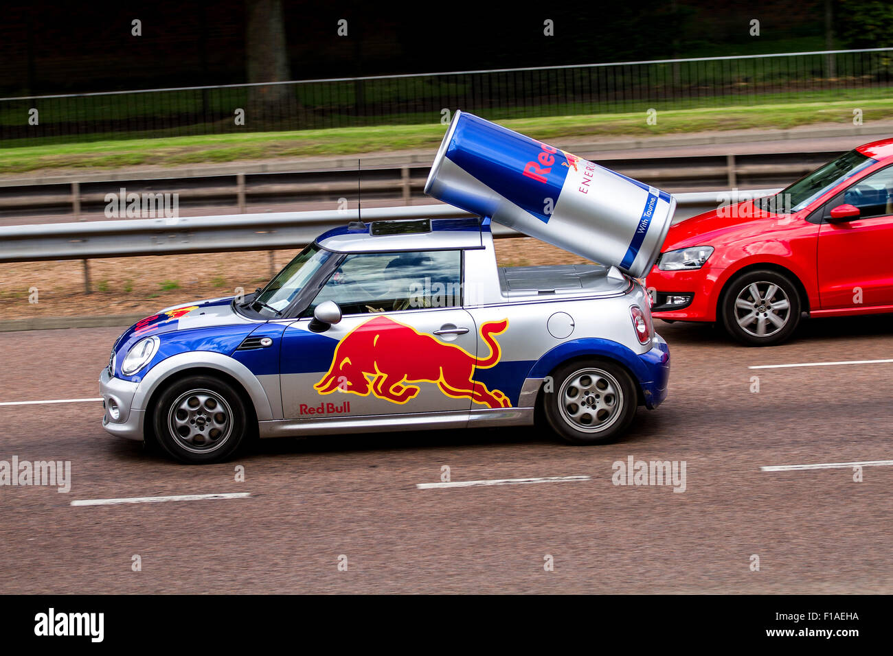 Red Bull energy drink advertisement car travelling along the Kingsway Dual Carriageway in Dundee, UK Stock Photo