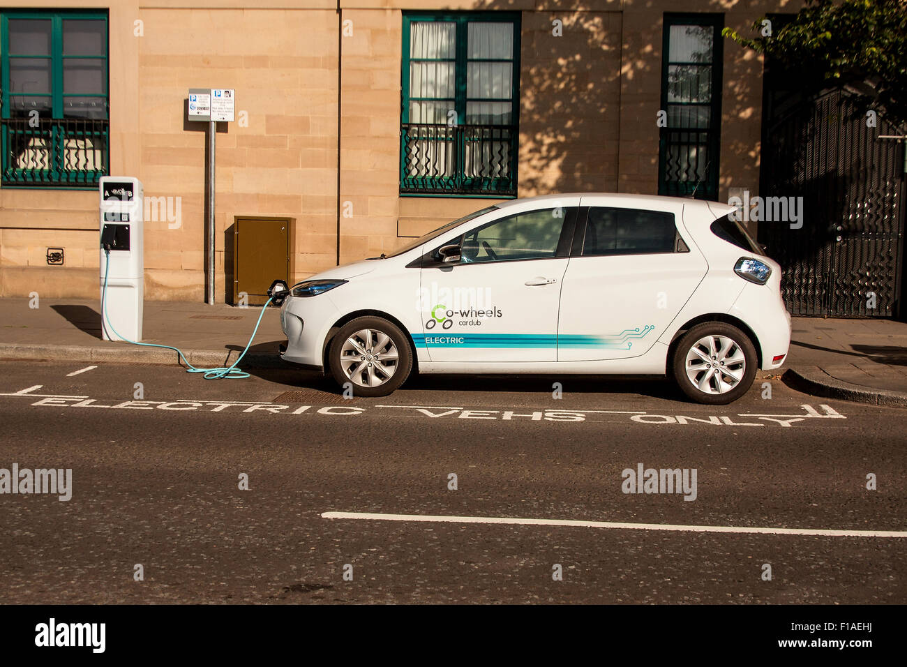 Electric car parked at the "Electric Vehicles Only" recharging point in