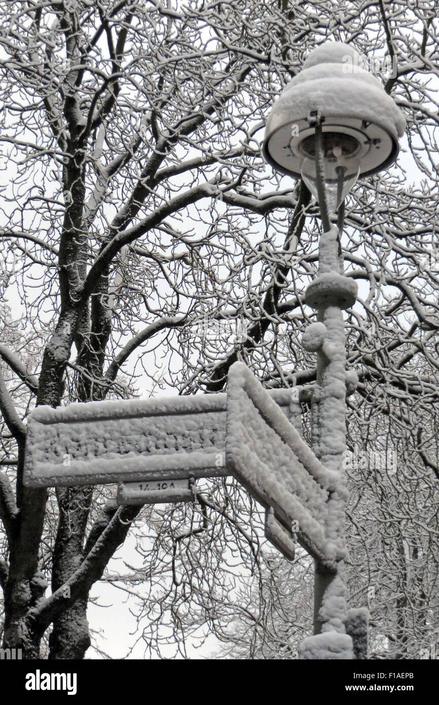 Berlin, Germany, added snowed road signs on a lamppost Stock Photo