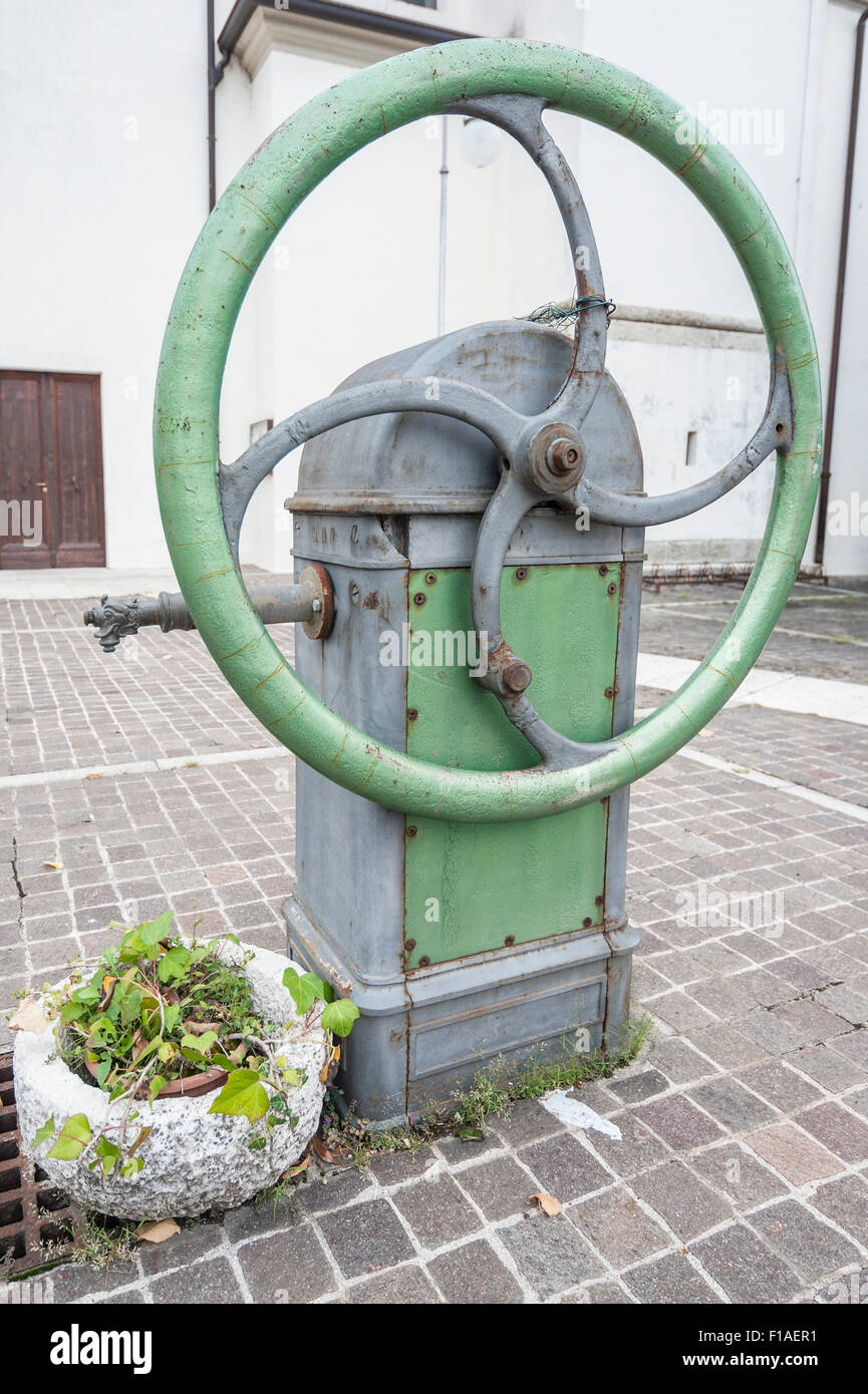 Old water pump, with operation at handwheel Stock Photo