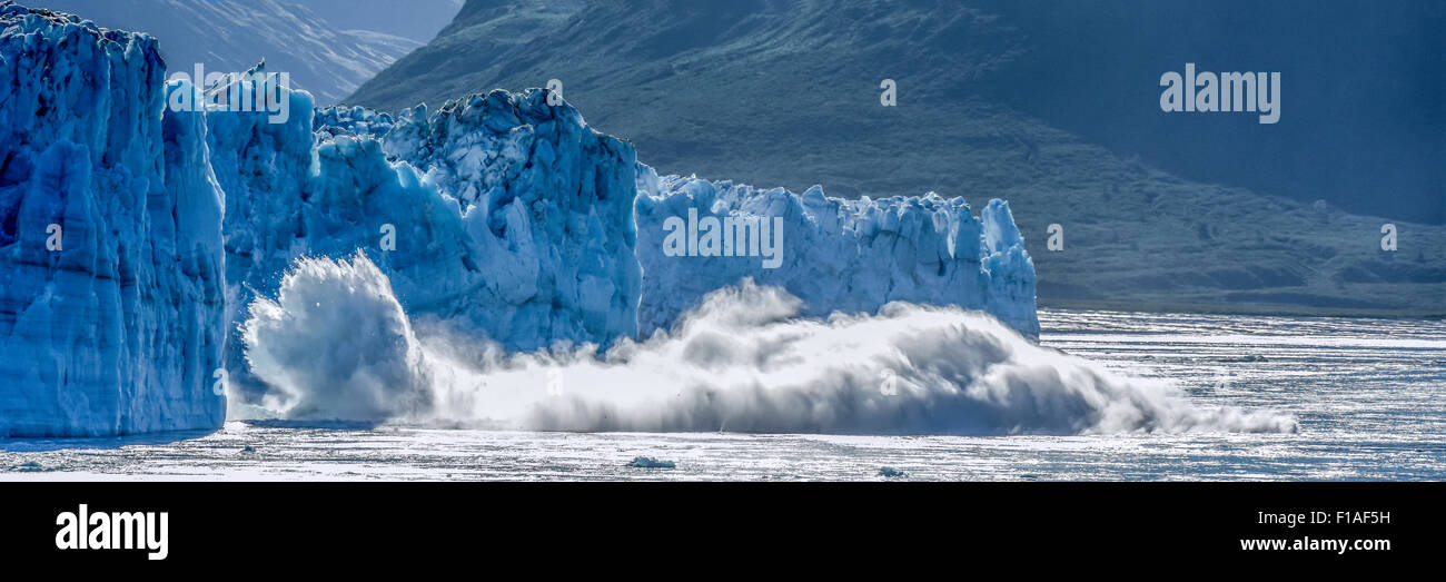 Alaska cruise - calving glacier - Hubbard - global warming & climate change - a melting iceberg calves - St. Elias Alaska - Yukon, Canada Stock Photo