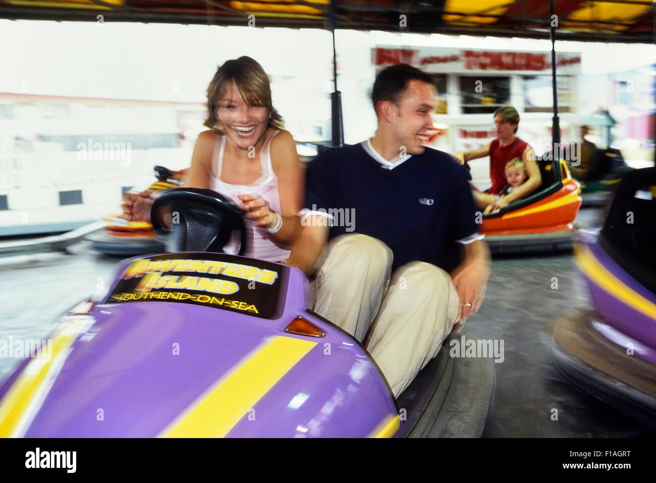 Couple riding the Dodgems at Adventure Island. Southend-on-Sea. Essex. England Stock Photo