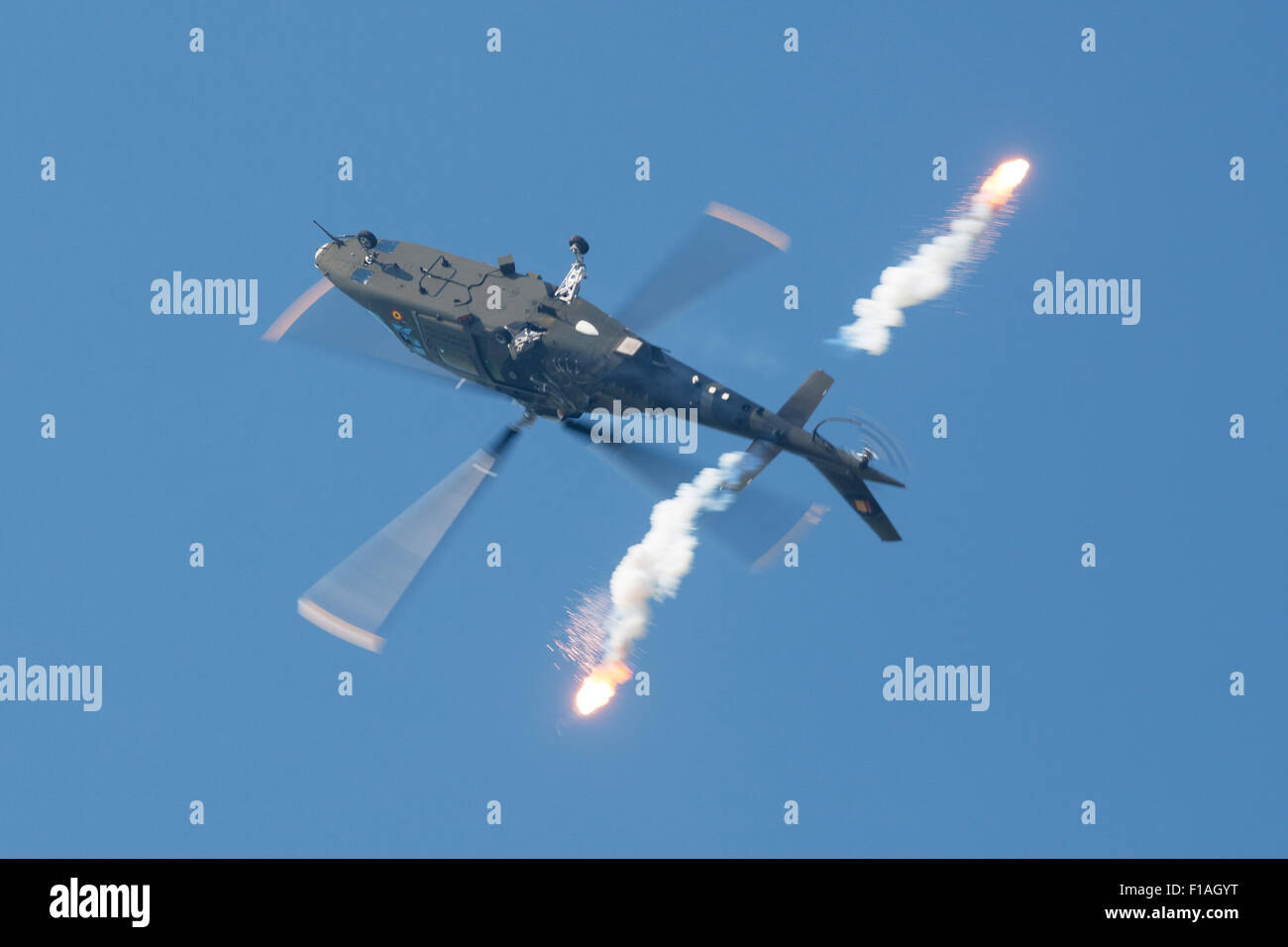 Sliac, Slovakia. 30th August, 2015. A-109 Agusta of Belgian Air Force releases flares at SIAF airshow in Sliac, Slovakia on August 30, 2015 Credit:  Lubos Paukeje/Alamy Live News Stock Photo
