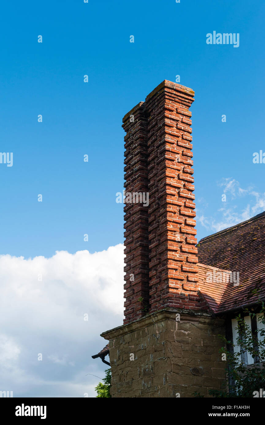 Shropshire, UK. A sixteenth century brick chimney on an old house Stock Photo