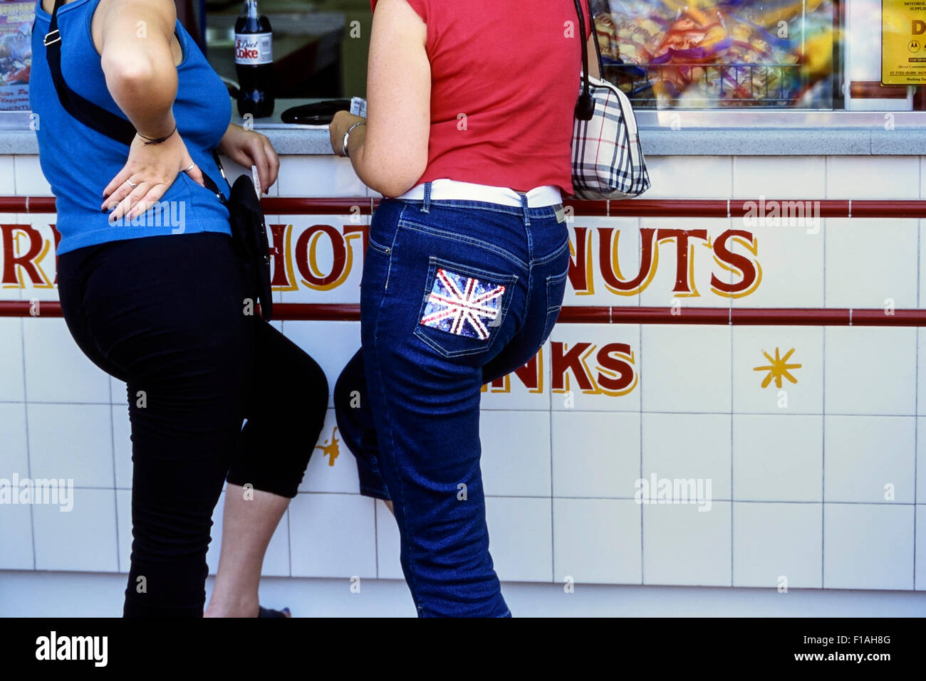 Two women standing at a fast food outlet. Southend-on-Sea. Essex. England. UK Stock Photo