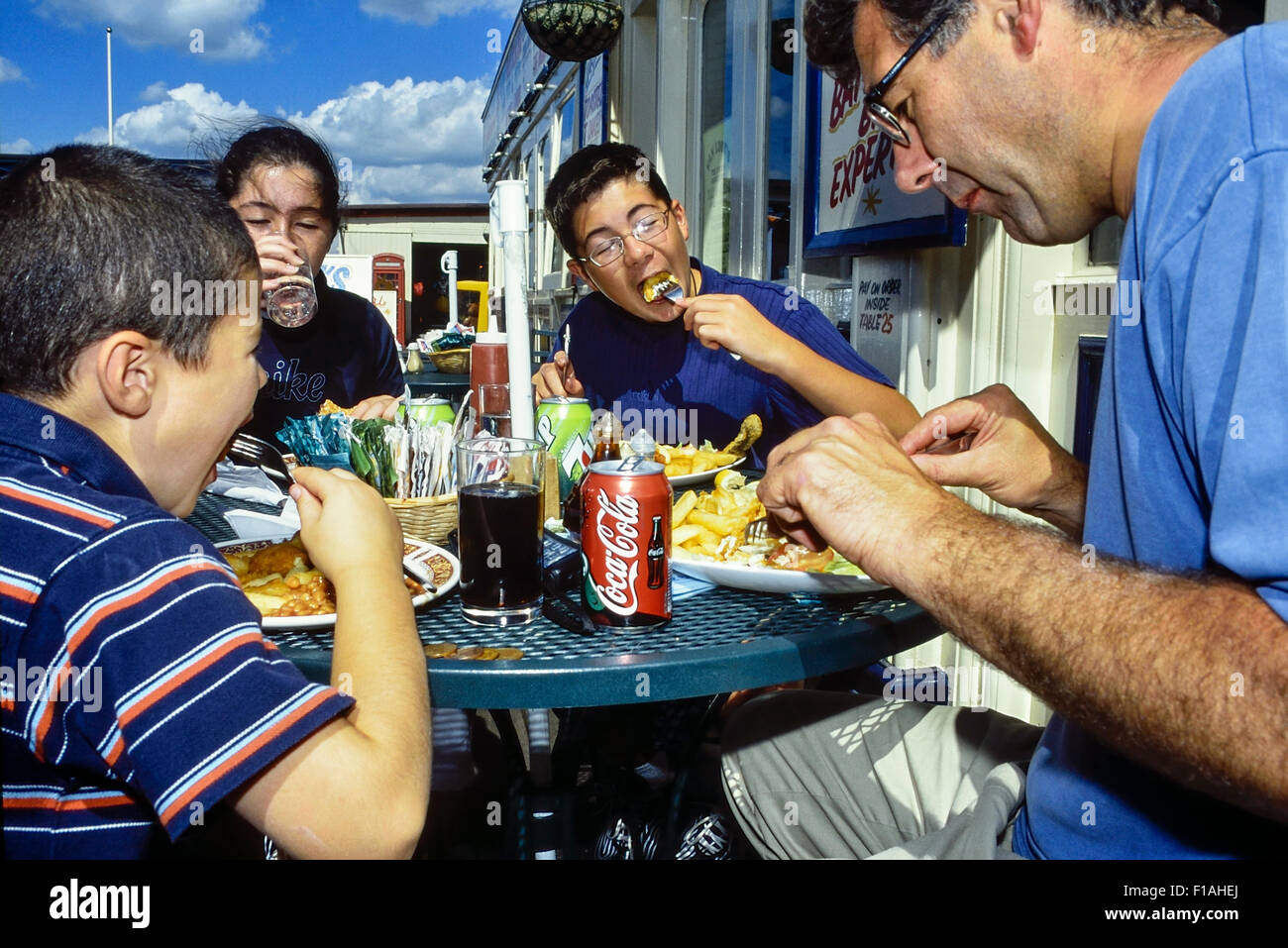 A family eating fish and chip. Southend. Essex. England. UK Stock Photo