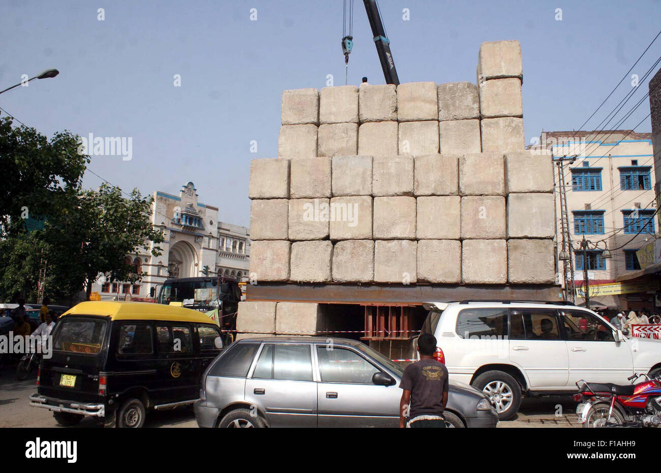 Heavy machineries busy in construction work of Orange Line Metro Train project under the supervision of Provincial Development Department at Lakshmi Chowk in Lahore on Monday, August 31, 2015. Stock Photo