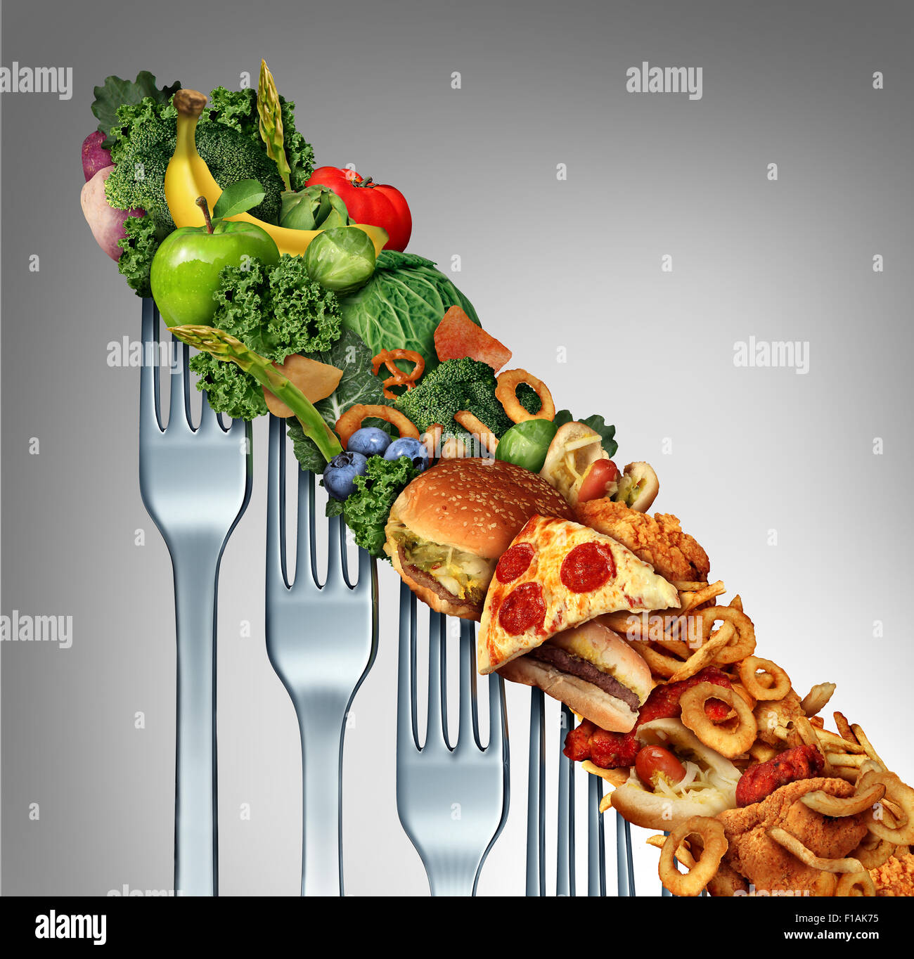 Diet relapse change as a healthy lifestyle slowly goes downward to greasy unhealthy fast food concept as a dieting quality decline symbol of returning to bad eating habits as a group of descending forks with meal items on them. Stock Photo