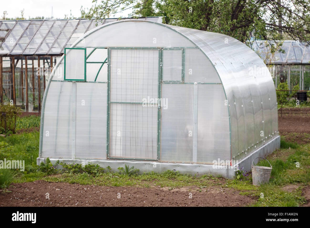 A small greenhouse with air vents in the garden Stock Photo Alamy