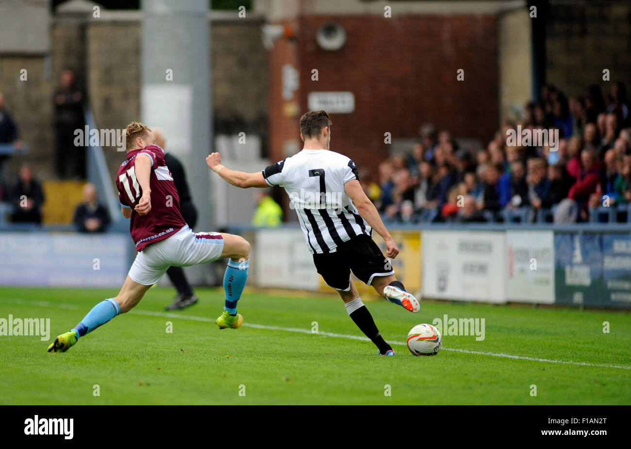Dorchester, England. 31st August 2015. Mark Molesley (left WFC) makes a challenge on Oakley Hanger (right) of Dorchester during the Southern Premier League derby game between Dorchester Town FC v  Weymouth FC at The Greene King Stadium. Dorchester won the game 1-0. Credit:  David Partridge / Alamy Live News Stock Photo