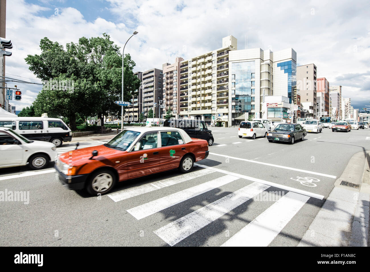 Japan, Kyoto, cars on street, houses in background Stock Photo Alamy