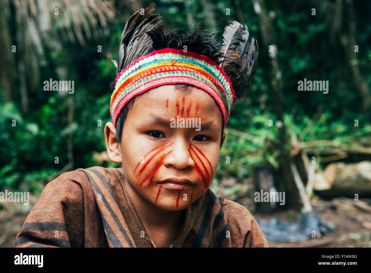 Peru, Madre de Dios Region, portrait of young boy wearing indigenous clothes Stock Photo