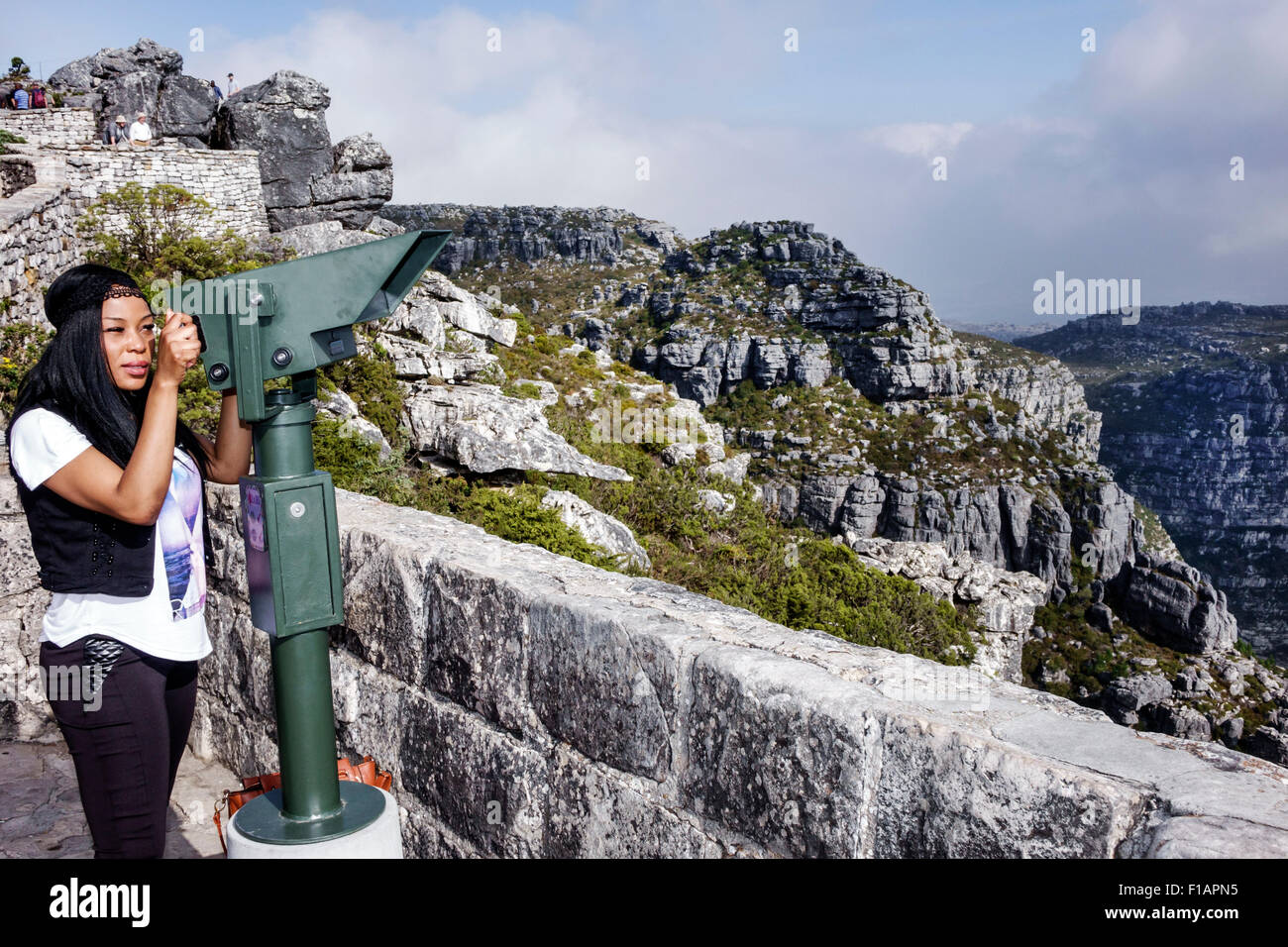 Cape Town South Africa,Table Mountain National Park,nature reserve,Black Afro American,Asian woman female women,top,telescopic binoculars viewer,panor Stock Photo