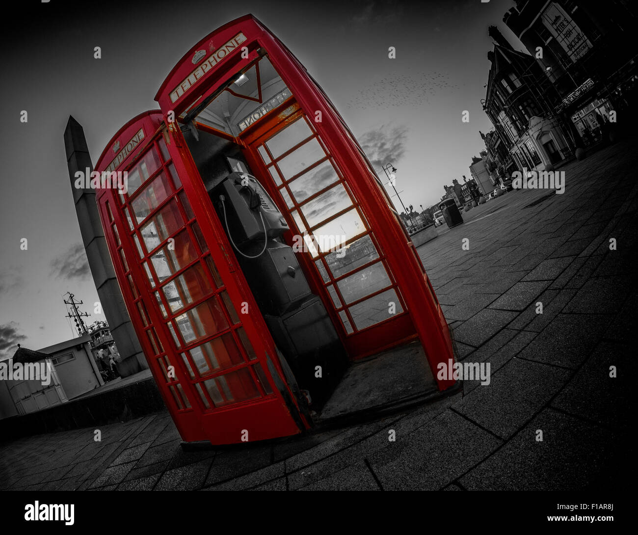 2 Red telephone boxes in Ramsgate United KIngdom using selective colour Stock Photo