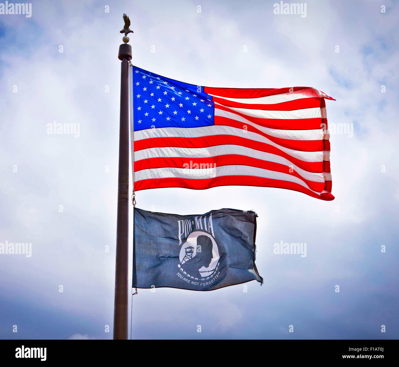 American and POW flags flying on display. Stock Photo