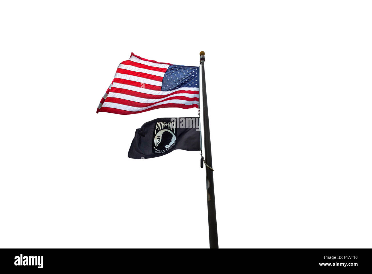 American and POW flags flying on display with a white background. Stock Photo