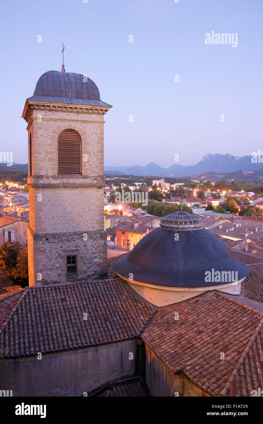 View overlooking the neo classical bell tower of the Church of St Saviour and the rooftops of medieval Crest, La Drôme, France. Stock Photo