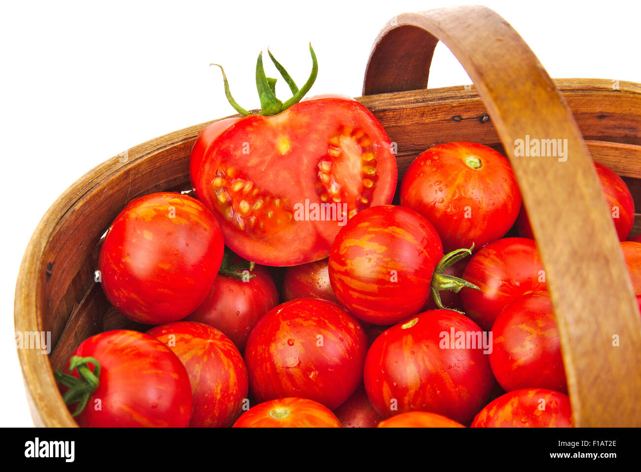 Fresh red tomatoes in wicker basket isolated on white background Stock ...