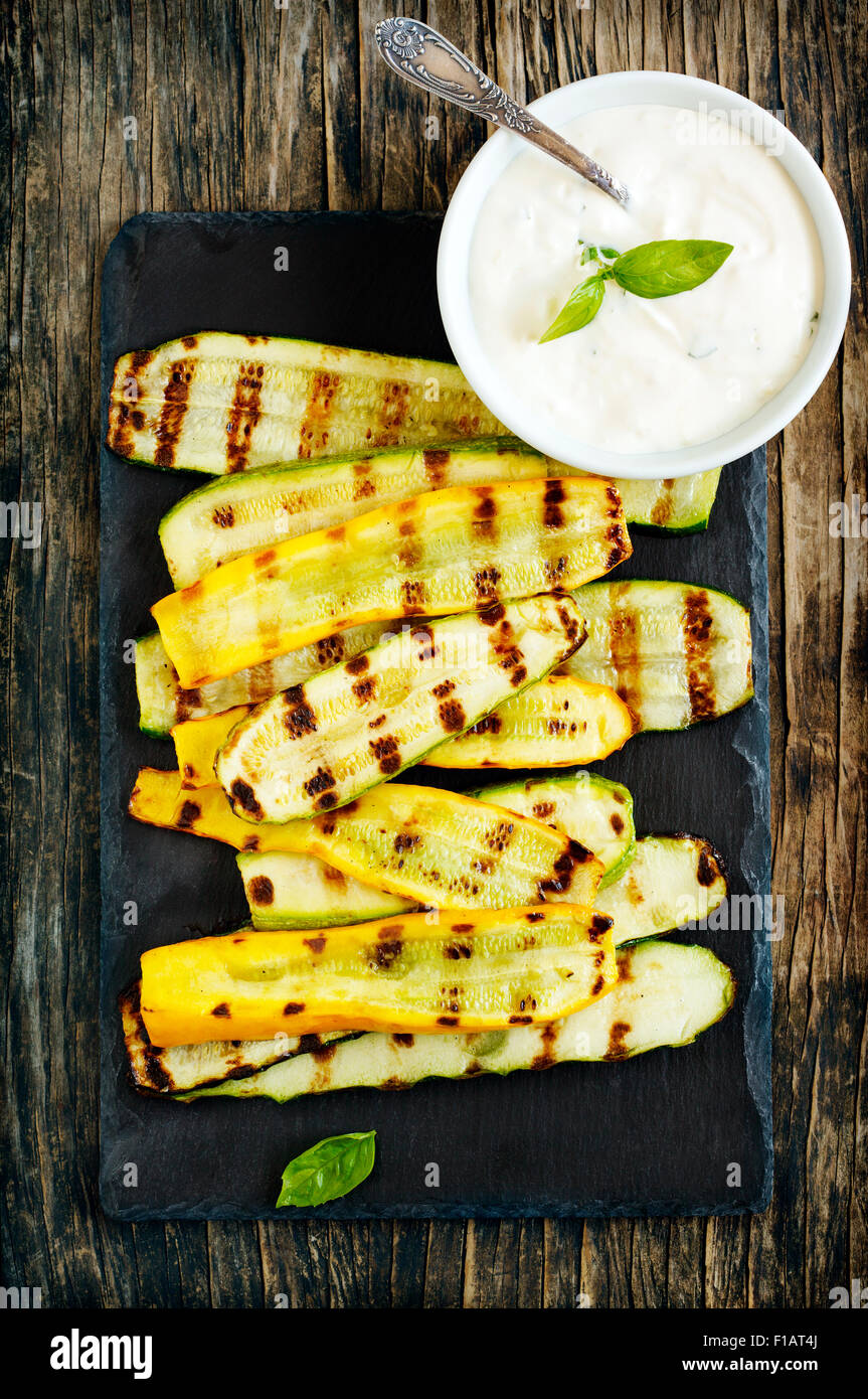 Grilled zucchini with sauce Stock Photo - Alamy