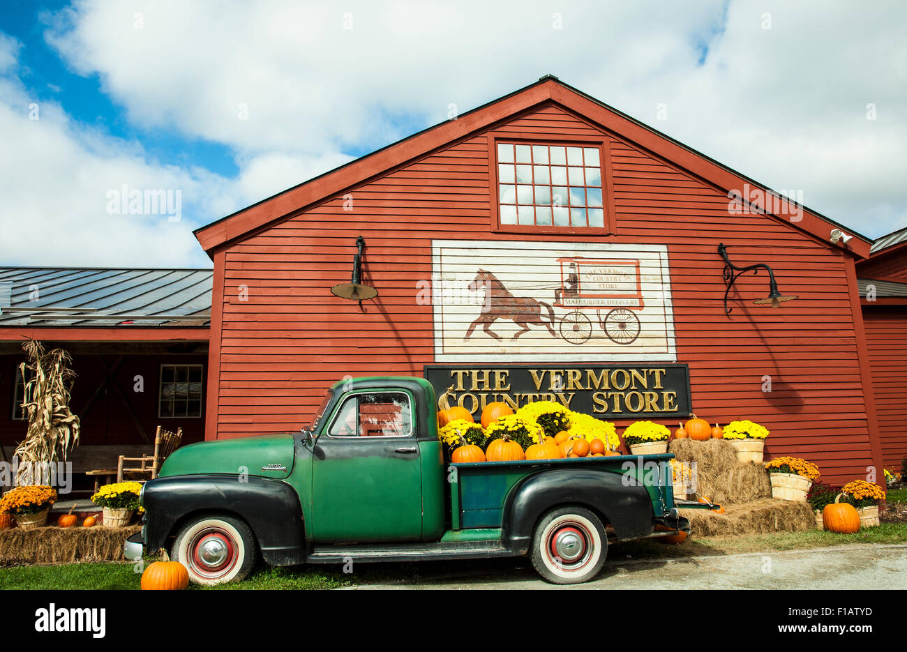 Colorful autumn pumpkins, chrysanthemums1953 Chevy pickup truck at The Vermont Country Store Oct 2014 Weston,Vermont, fall New England, USA Stock Photo