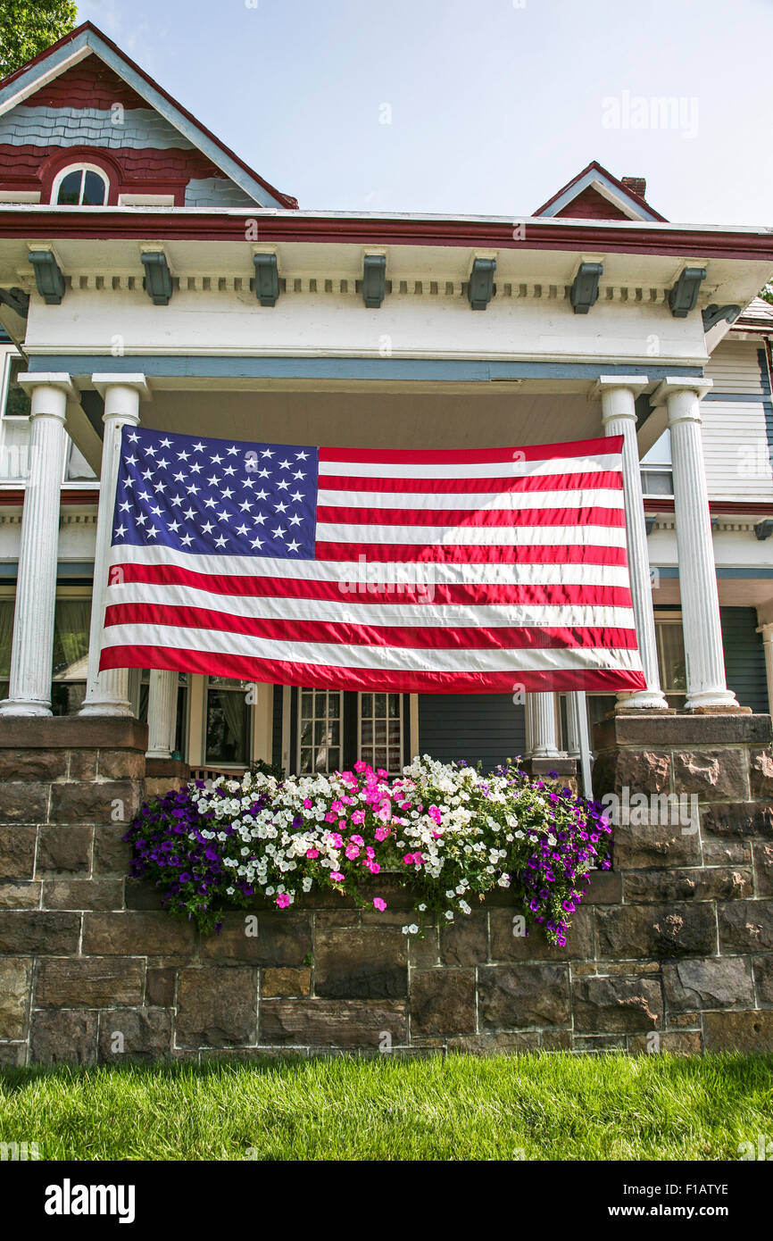 Large American flag on a Victorian house in Hightstown, New Jersey, USA, US flag close up Stock Photo