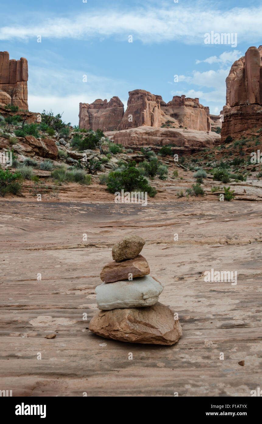 Cairns mark the way for hikers through Park Avenue in Arches National Park Stock Photo