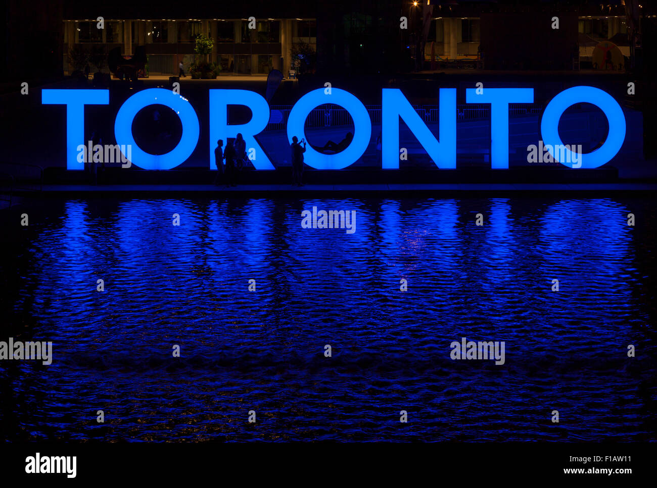 An illuminated blue 'Toronto' logo in Nathan Phillips Square, Toronto, Ontario, Canada. Stock Photo