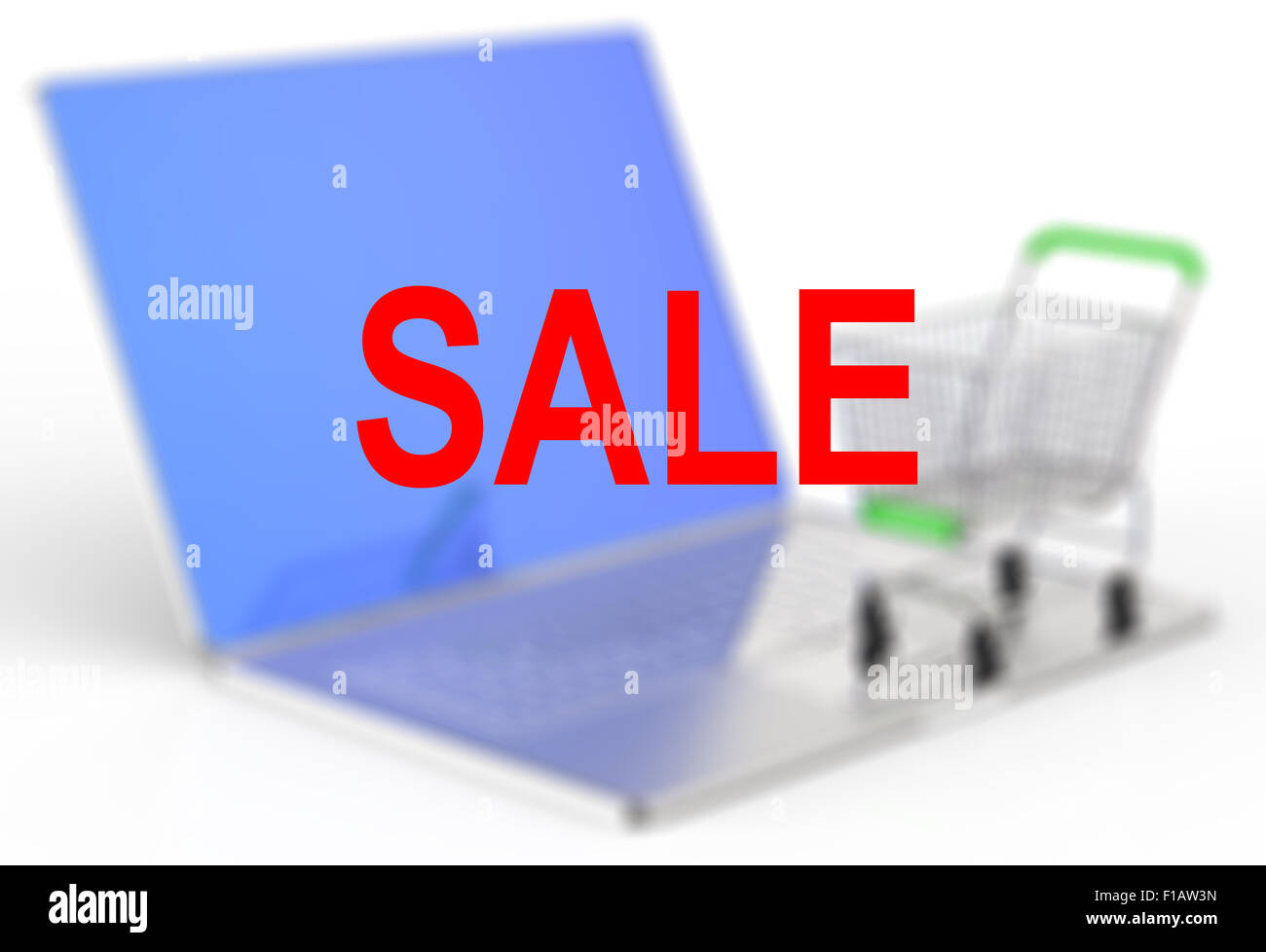 A shopping cart sits on a laptop to represent online shopping concept Stock Photo