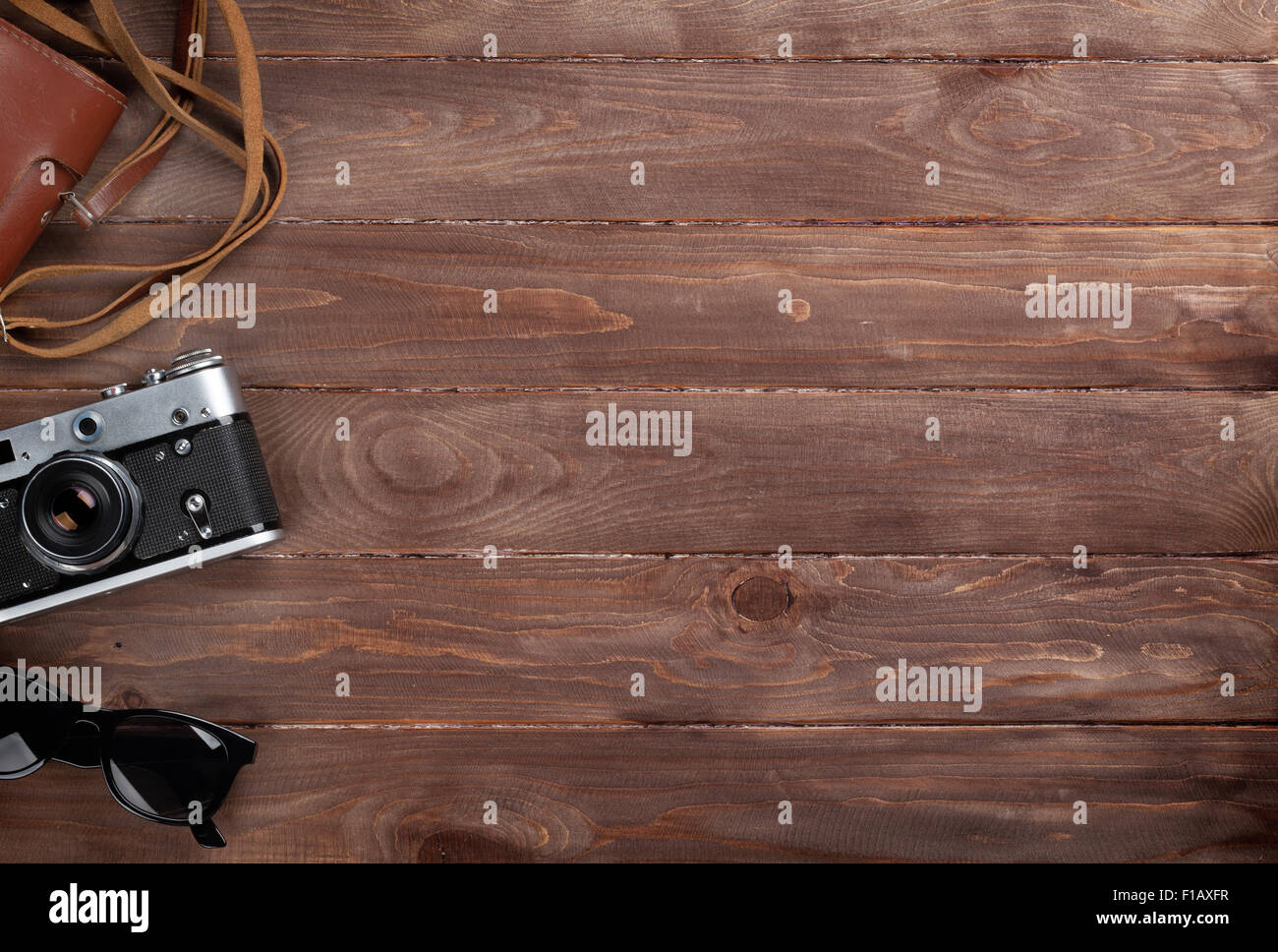 Camera and sunglasses on wooden desk table. Top view with copy space Stock  Photo - Alamy