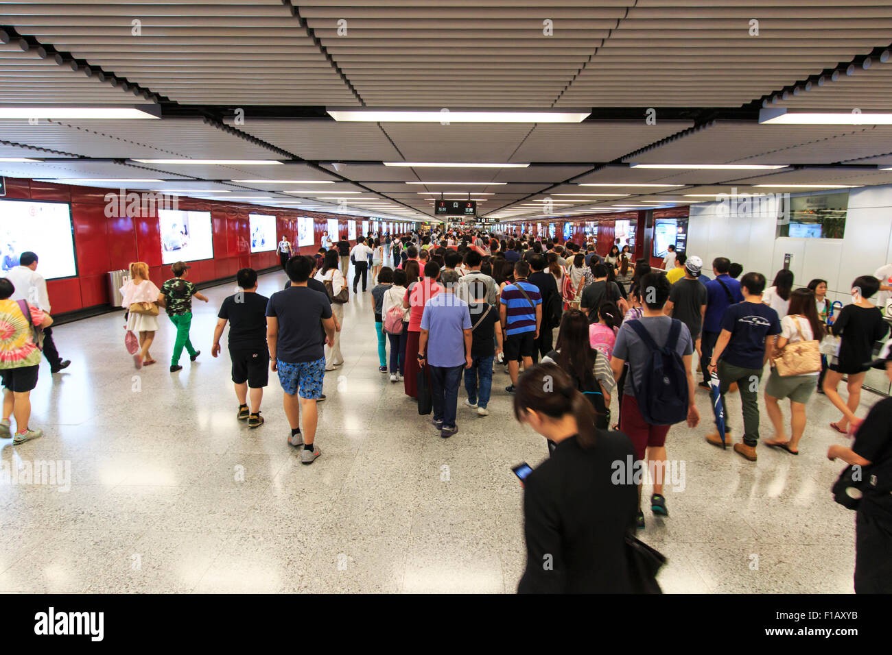 Kowloon, Hong Kong - August 14,2015: Commuters waiting for a train in the MTR Wan Chai in Hong Kong Stock Photo