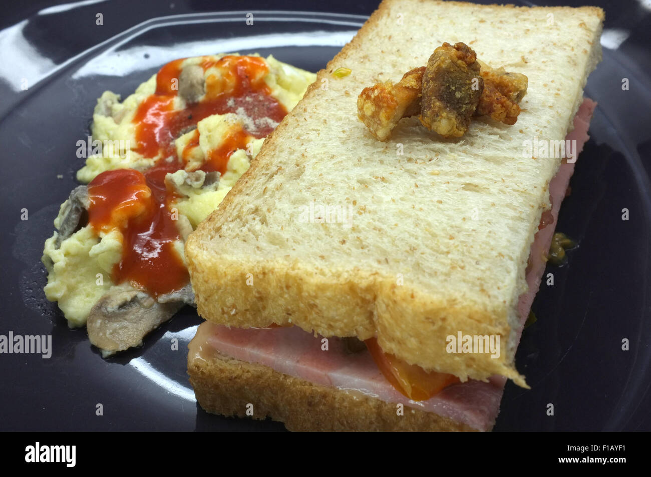 Ham and tomato sandwich with scrambled egg Stock Photo Alamy