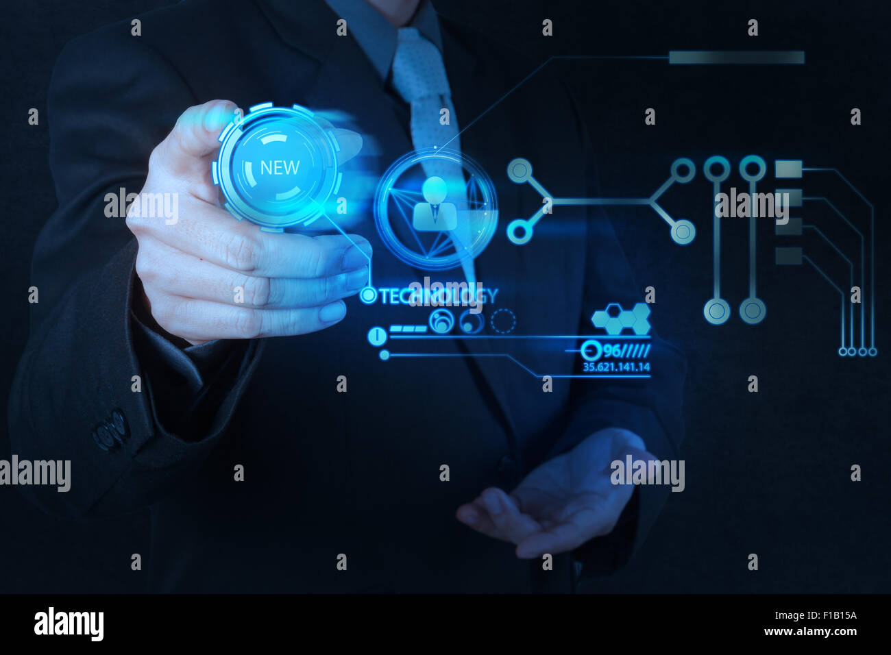 businessman hand pushing new technology button on modern computer as ...