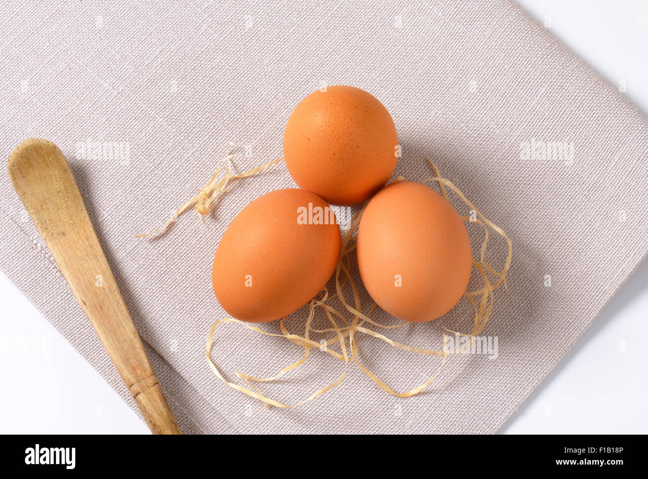 eggs with straw on place mat Stock Photo - Alamy