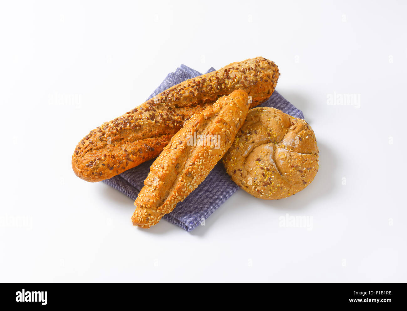 assorted bread rolls on blue napkin Stock Photo