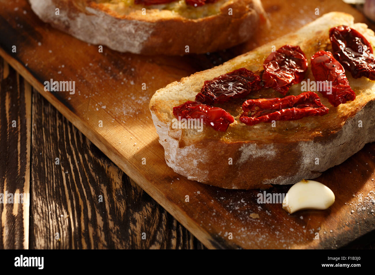 Bruschetta with dried tomatoes, garlic and olive oil. Traditional