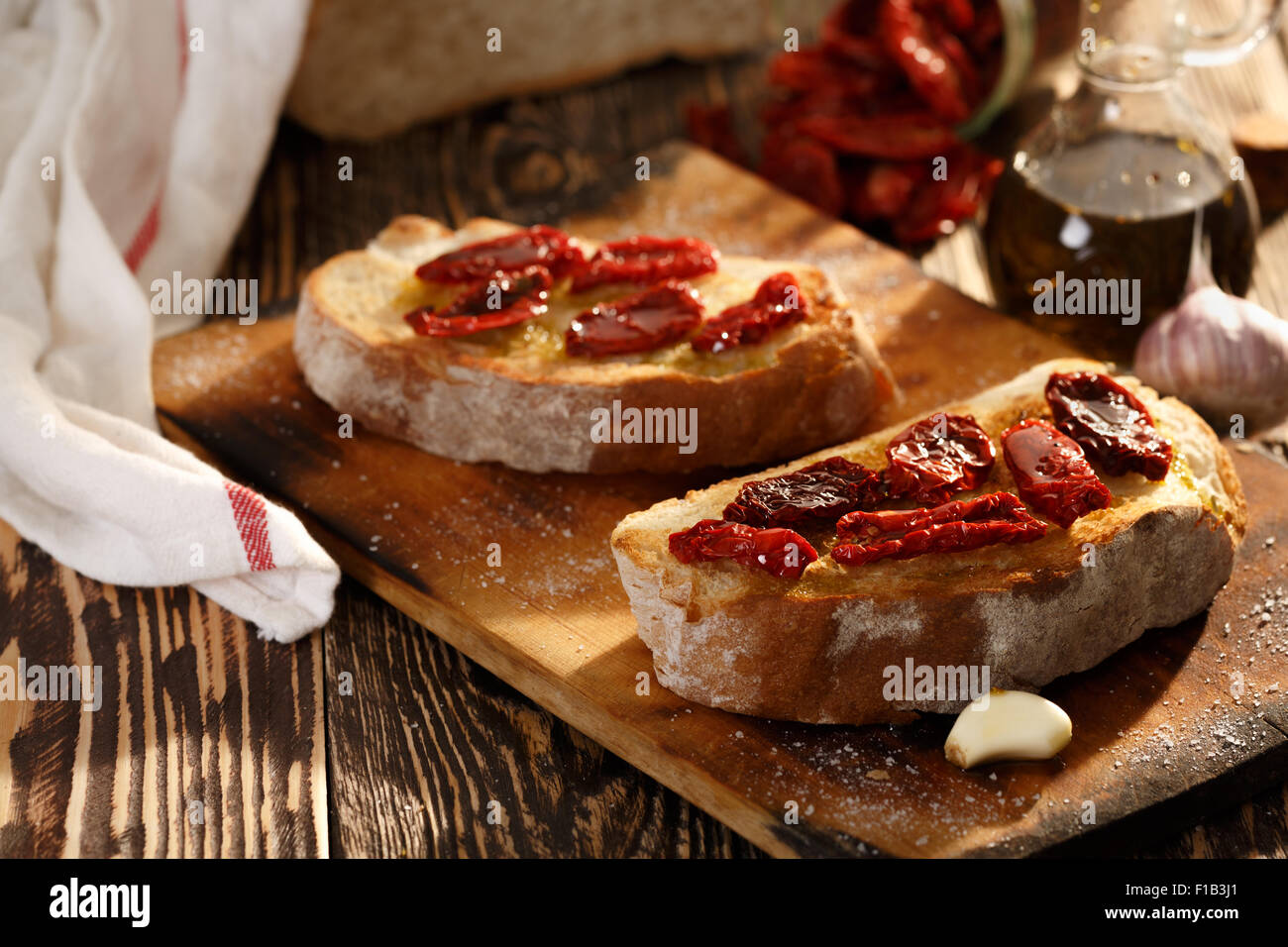 Bruschetta with dried tomatoes, garlic and olive oil. Traditional