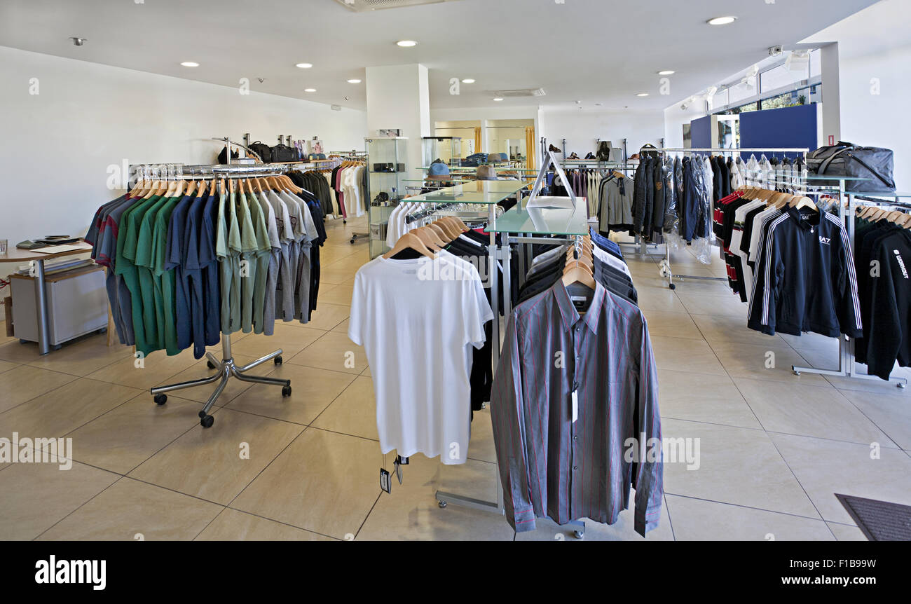 Men's fashion shop interior displaying high end sportswear, shirts