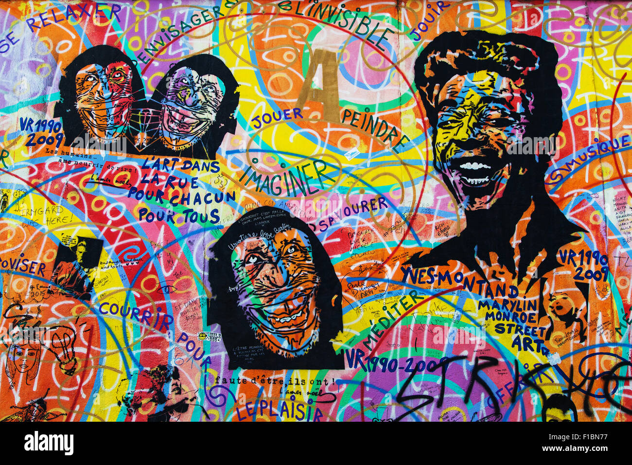 Portraits in the mural 'Amour Paix' by Andreas Paulun on the East Side Gallery, Berlin, Germany. Stock Photo