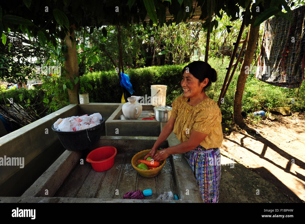Guatemala, Chimaltenango, mother washing vegetables(Maria Andrea Sequen Hernandez 30 years) Stock Photo
