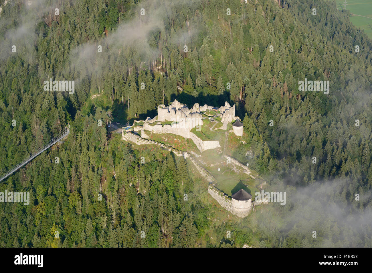 AERIAL VIEW. Ehrenberg Castle with some morning fog. Klause, Reutte, Tyrol, Austria. Stock Photo