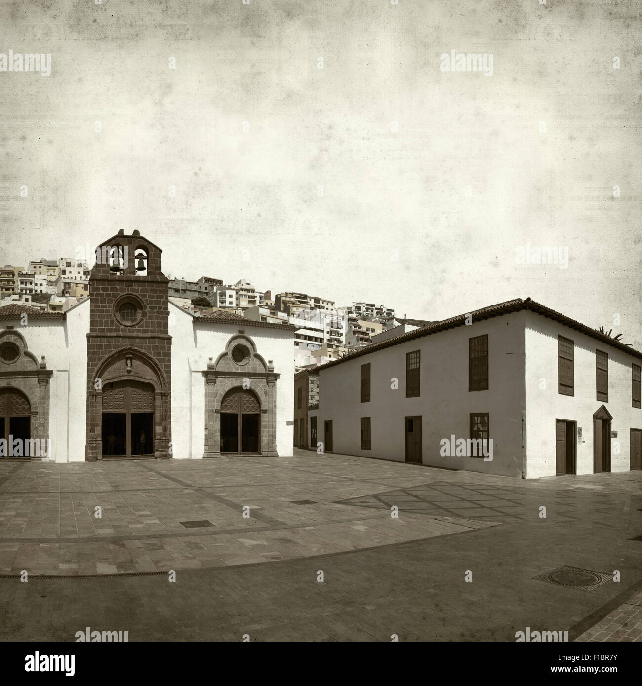 textured old paper background with historic part of San Sebastian de La Gomera Stock Photo
