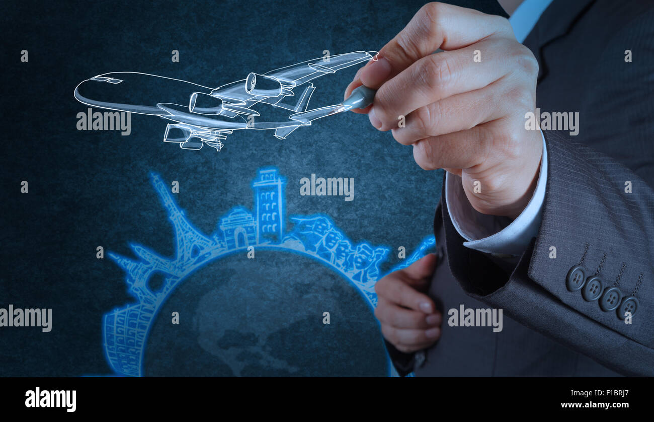 businessman hand draws airplane travel around the world as concept Stock Photo