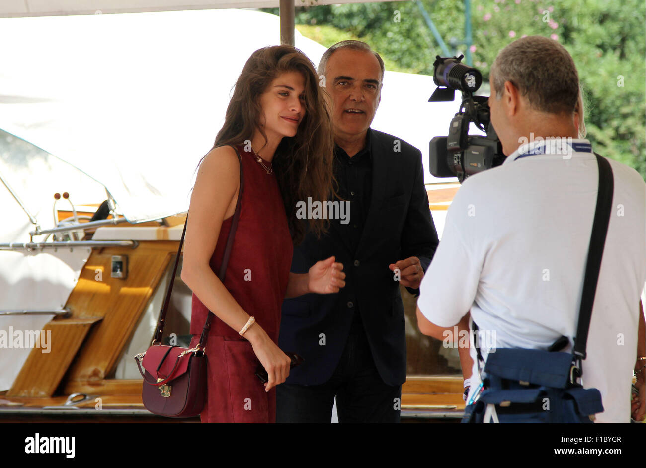 ITALY, Venice : Elisa Sednaoui (L) , the patroness of the 72th Venice International Film Festival with Director of the Venice Film Festival Alberto Barbera during the 72th Venice Film Festival at Venice on September 01, 2015 Stock Photo