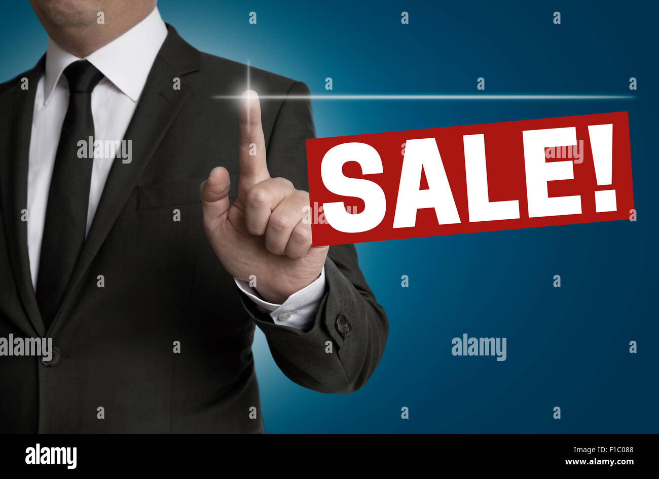 sale touchscreen is operated by businessman concept. Stock Photo