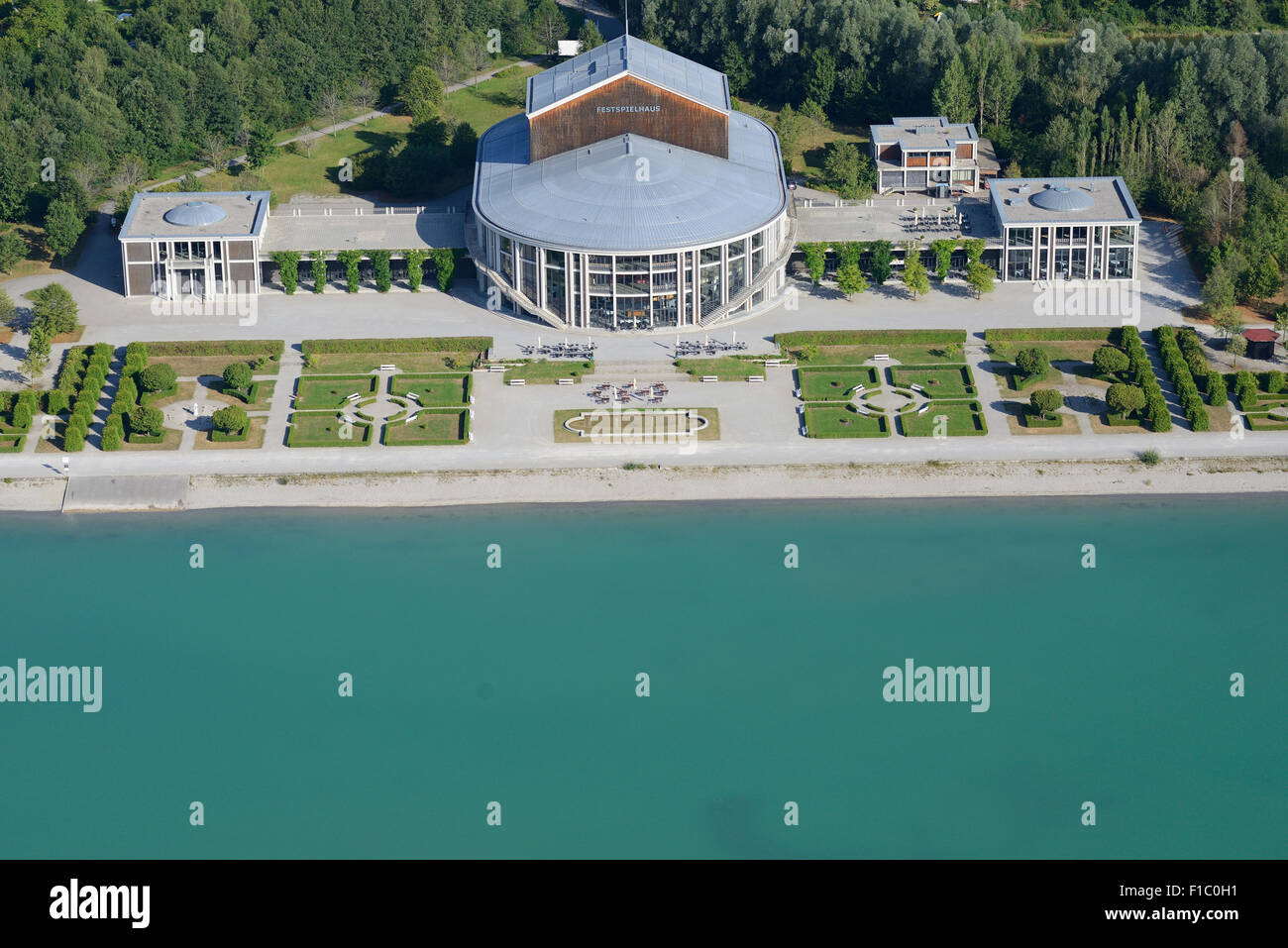 AERIAL VIEW. Music theater and baroque garden on the bank of Lake Forggensee. Festspielhaus of Füssen, Bavaria, Germany. Stock Photo