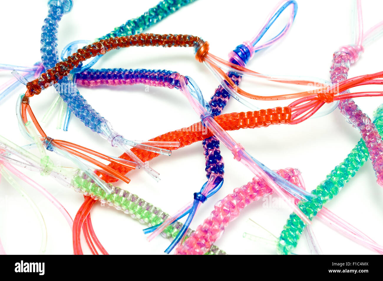 Colorful plastic ropes over white background Stock Photo - Alamy