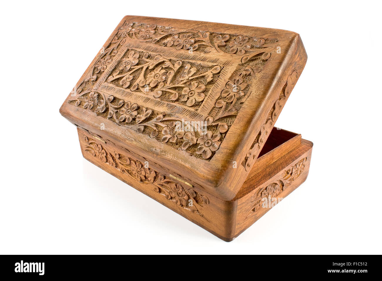 Open wooden casket with carved lid from India isolated on white Stock Photo