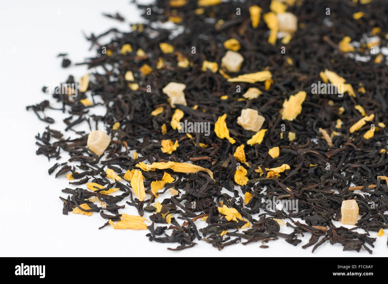 Chinese and Ceylon Tea mango pieces and sunflower blossoms Stock Photo