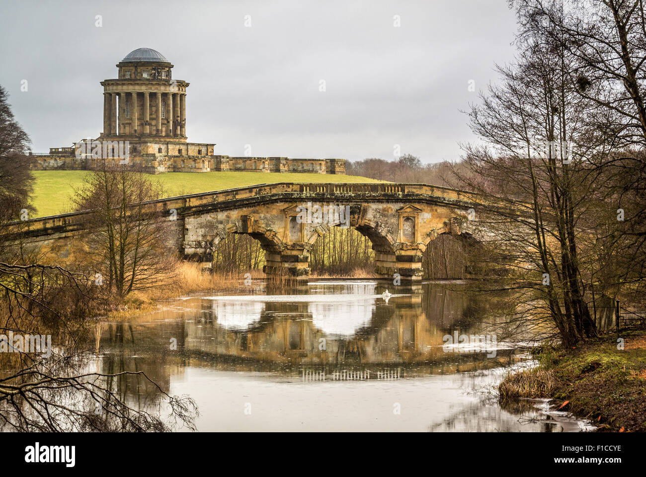 Castle Howard, New River Bridge with Mausoleum in background. Stock Photo