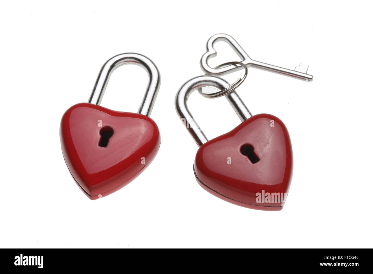 Tiny heart-shaped lock, padlock, as love lock with keys with heart-shaped handle Stock Photo